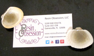 seashell resin magnets holding a business card