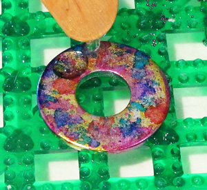applying resin to an alcohol ink pendant