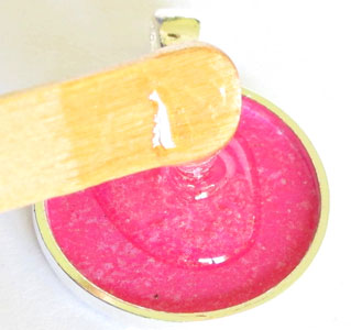 pouring resin into a jewelry bezel
