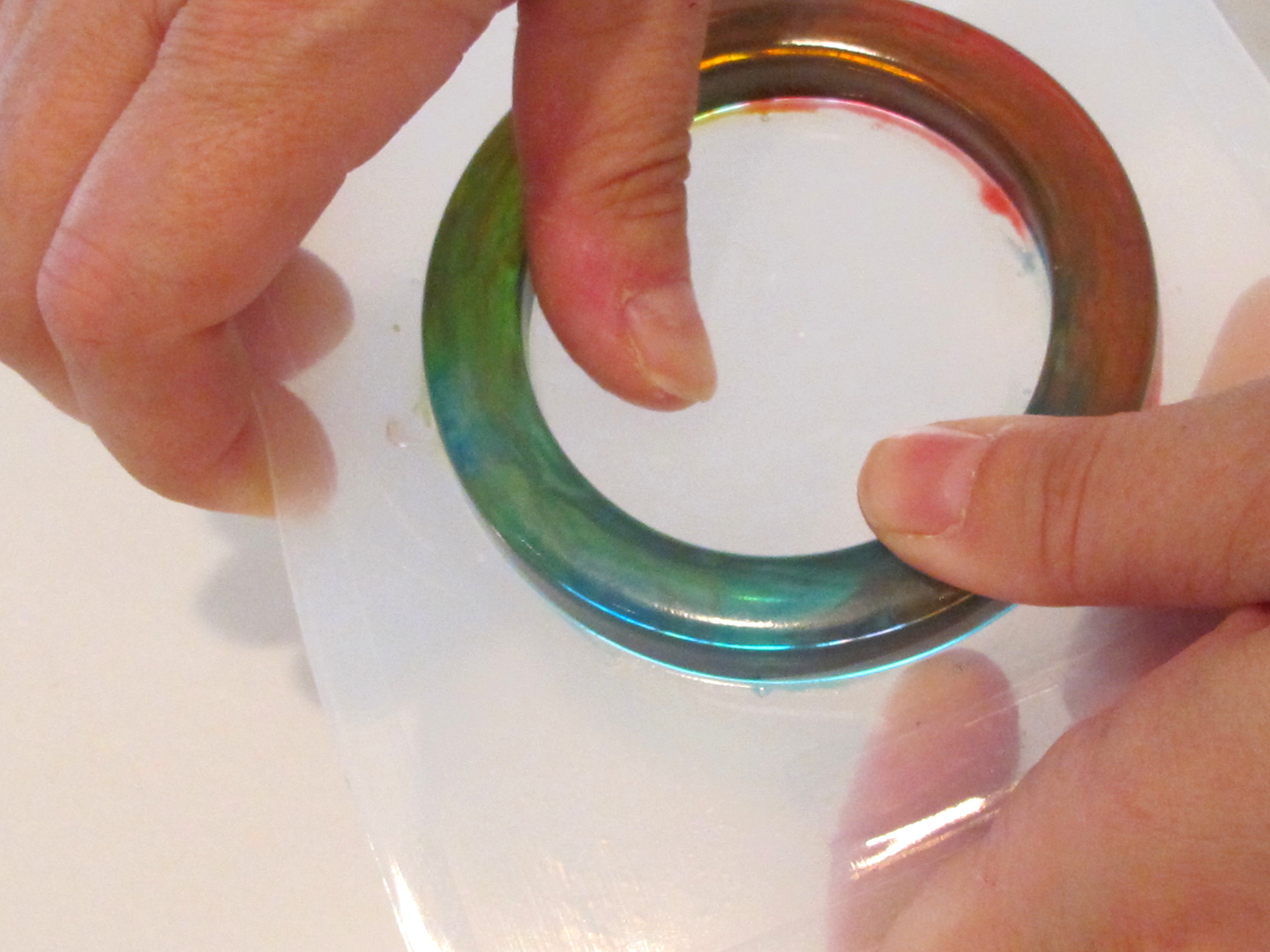 demolding a resin bracelet from a plastic mold