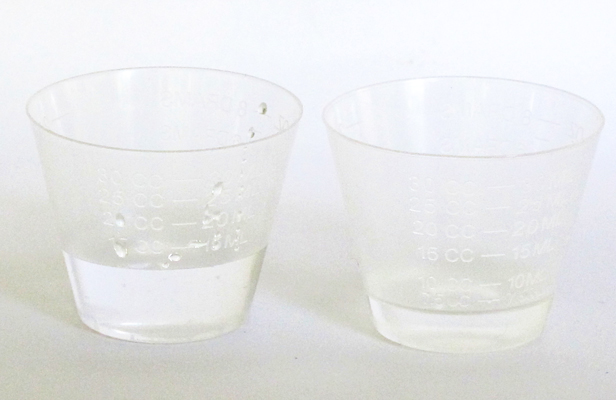 resin and hardener in mixing cups