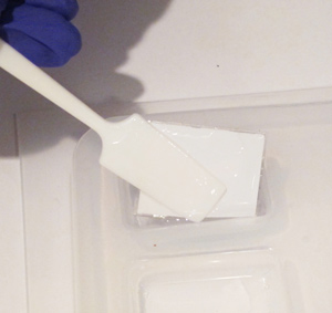 placing paper in a resin mold