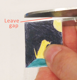 trimming packing tape away from an image before including in resin