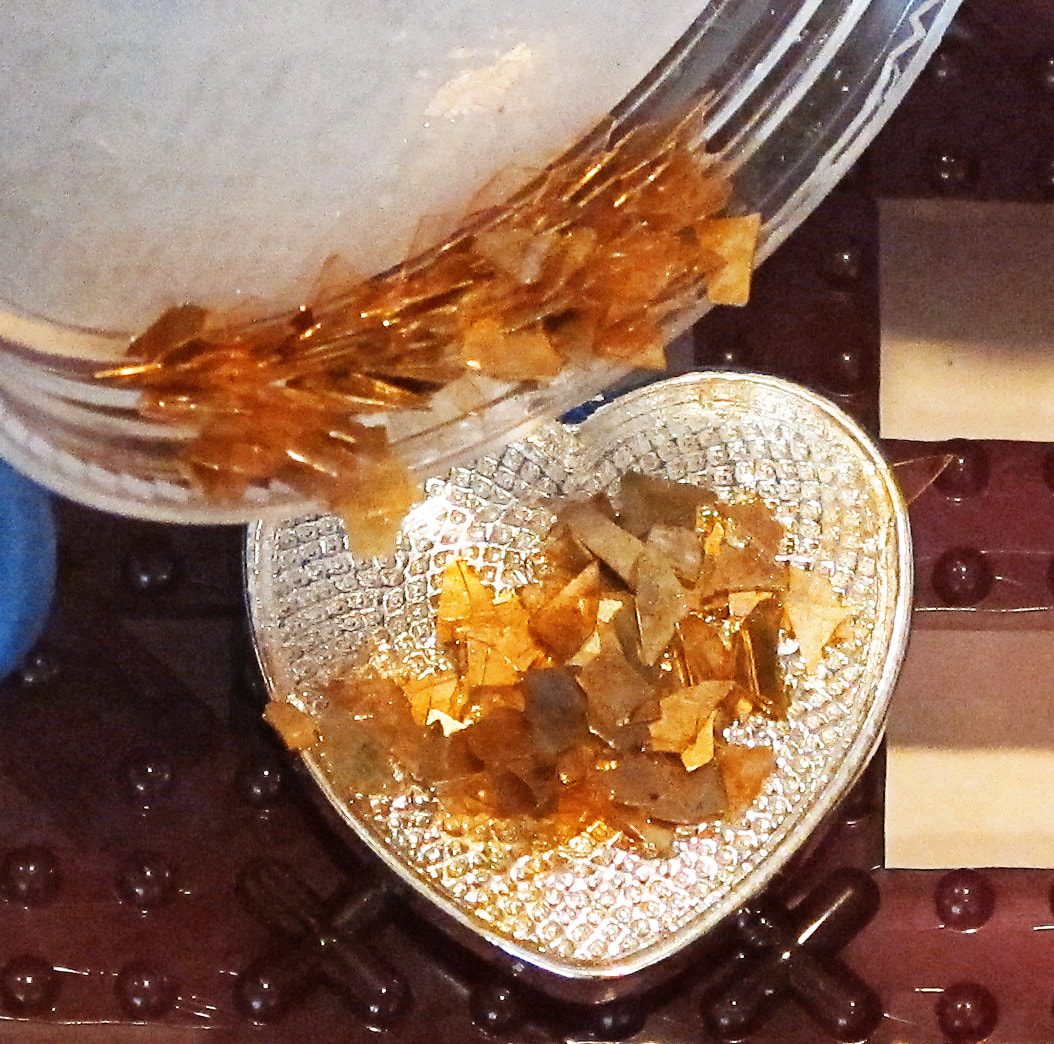 glass glitter shards in a resin pendant