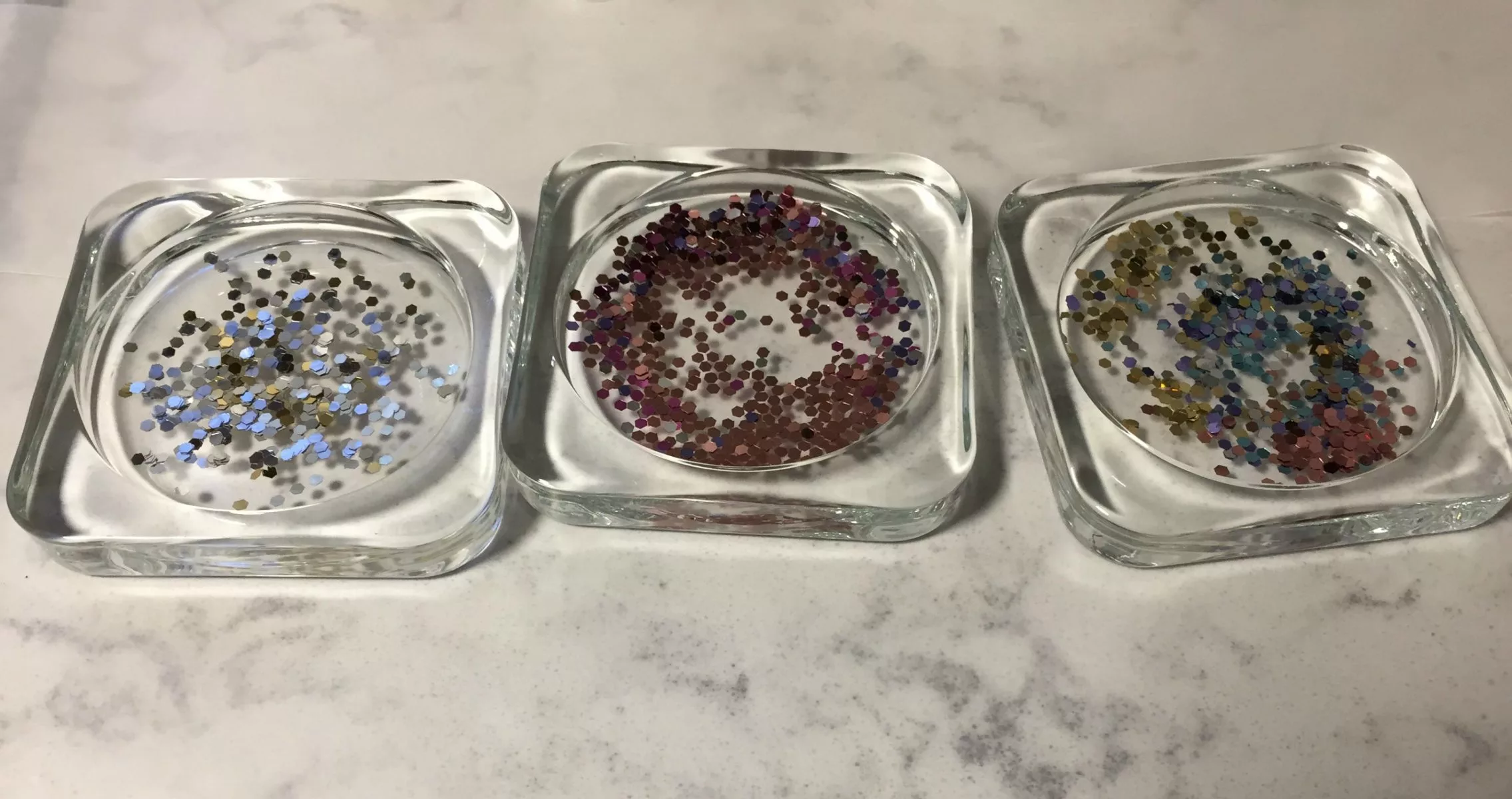 adding sparkles to resin coasters