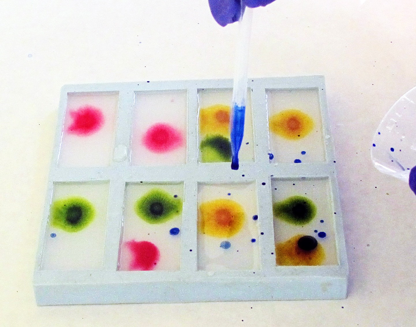 adding blue ink color to resin with a pipette