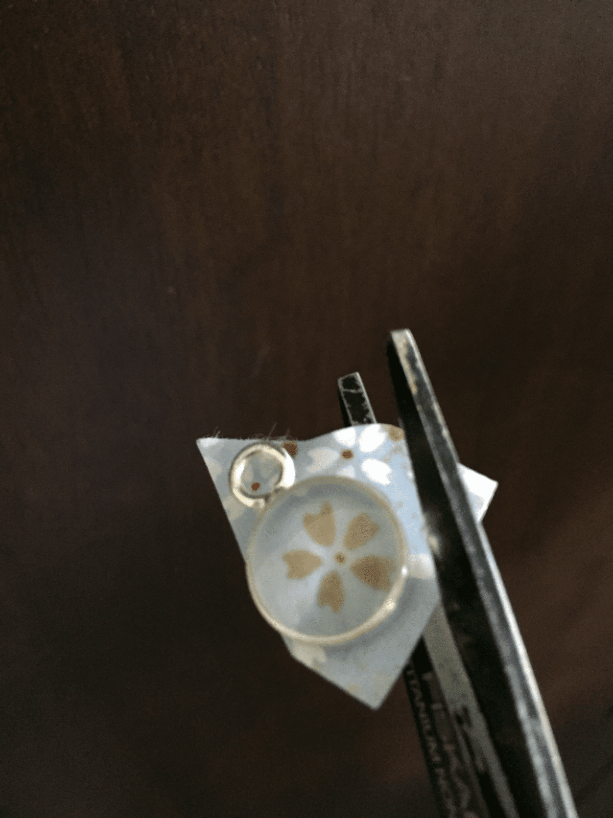 trimming paper away from metal bezel