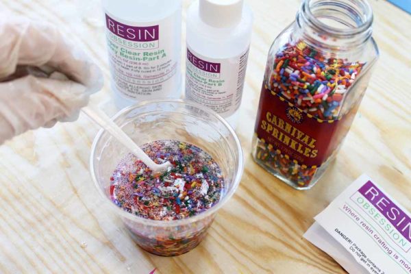 mixing candy sprinkles into epoxy