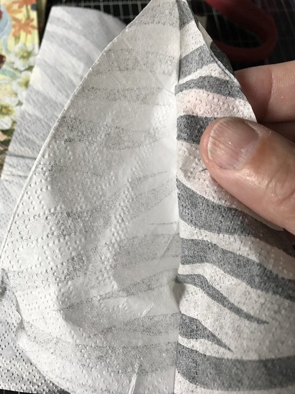 peeling a napkin apart