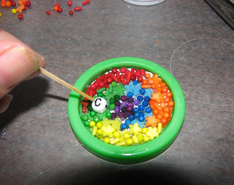 Placing Letter Beads in resin