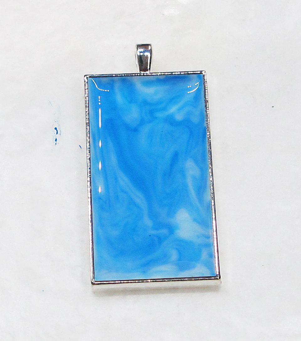 marbled blue resin background in pendant