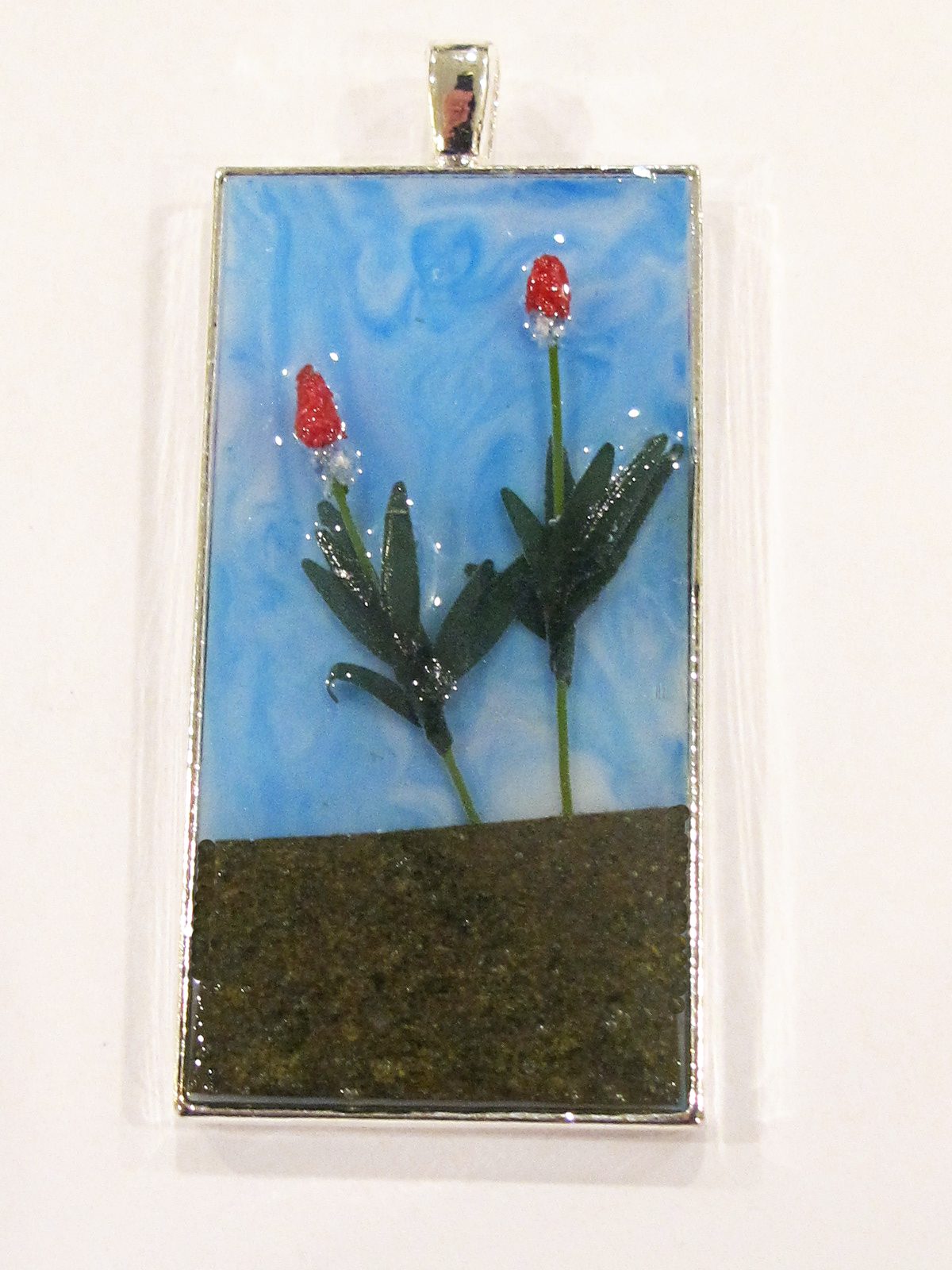diorama resin pendant with flowers