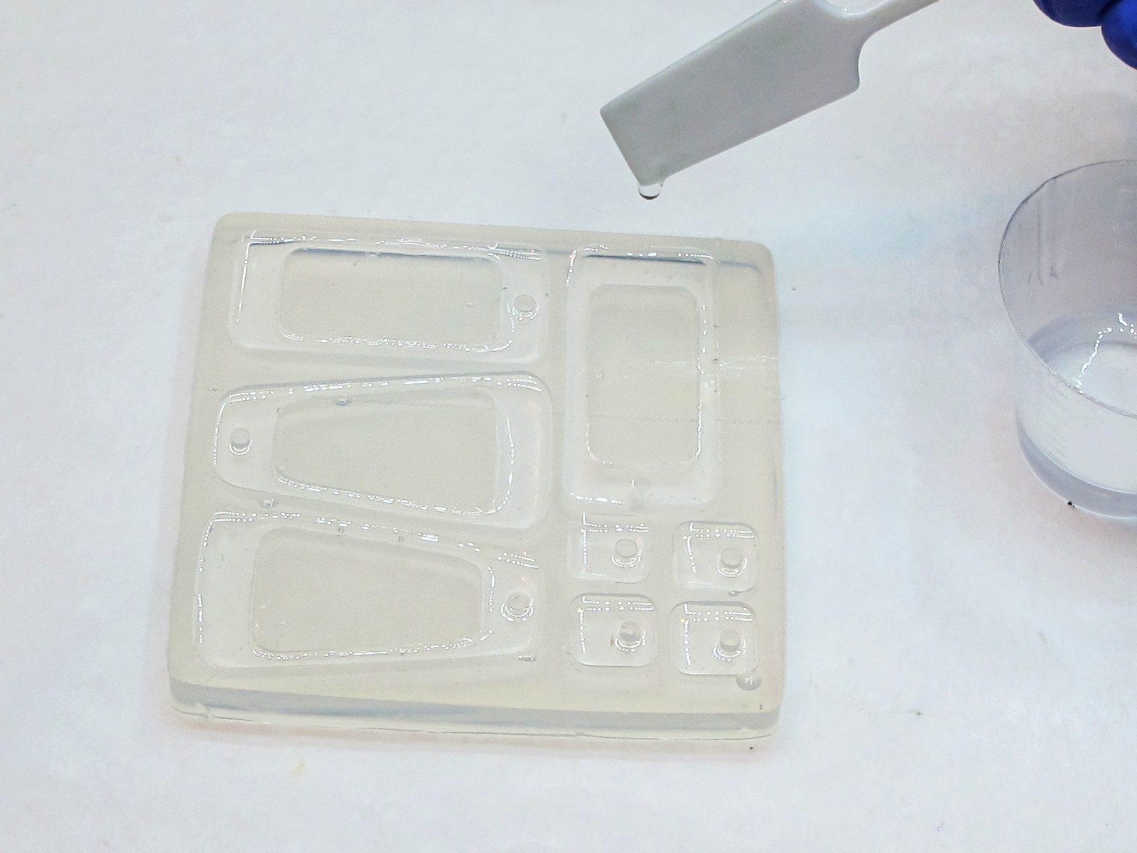 filling a silicone mold with clear epoxy