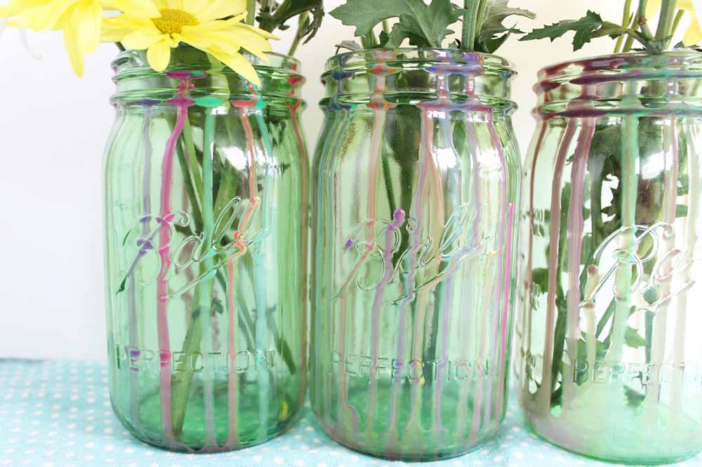 finished dripped resin on mason jar with flowers in jar