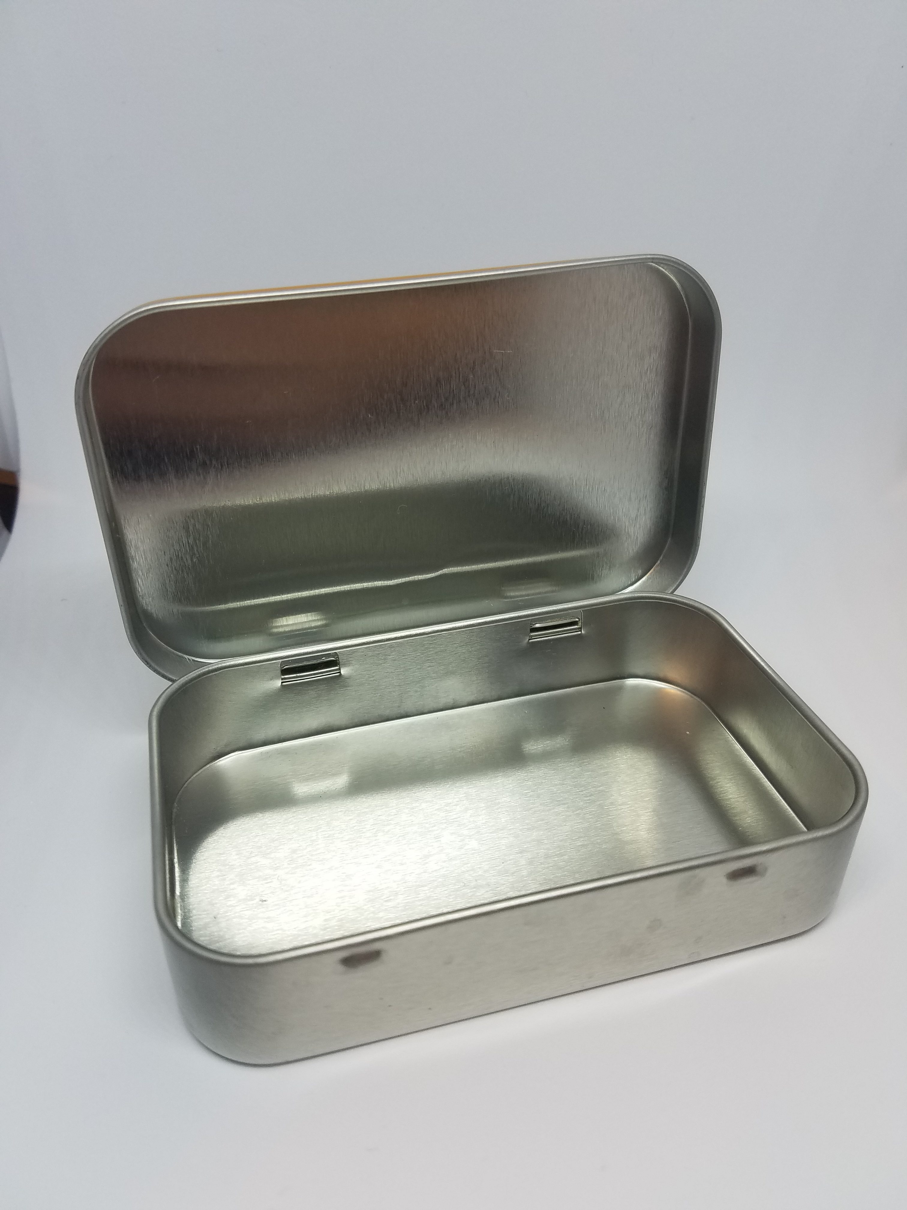 empty silver mint tin