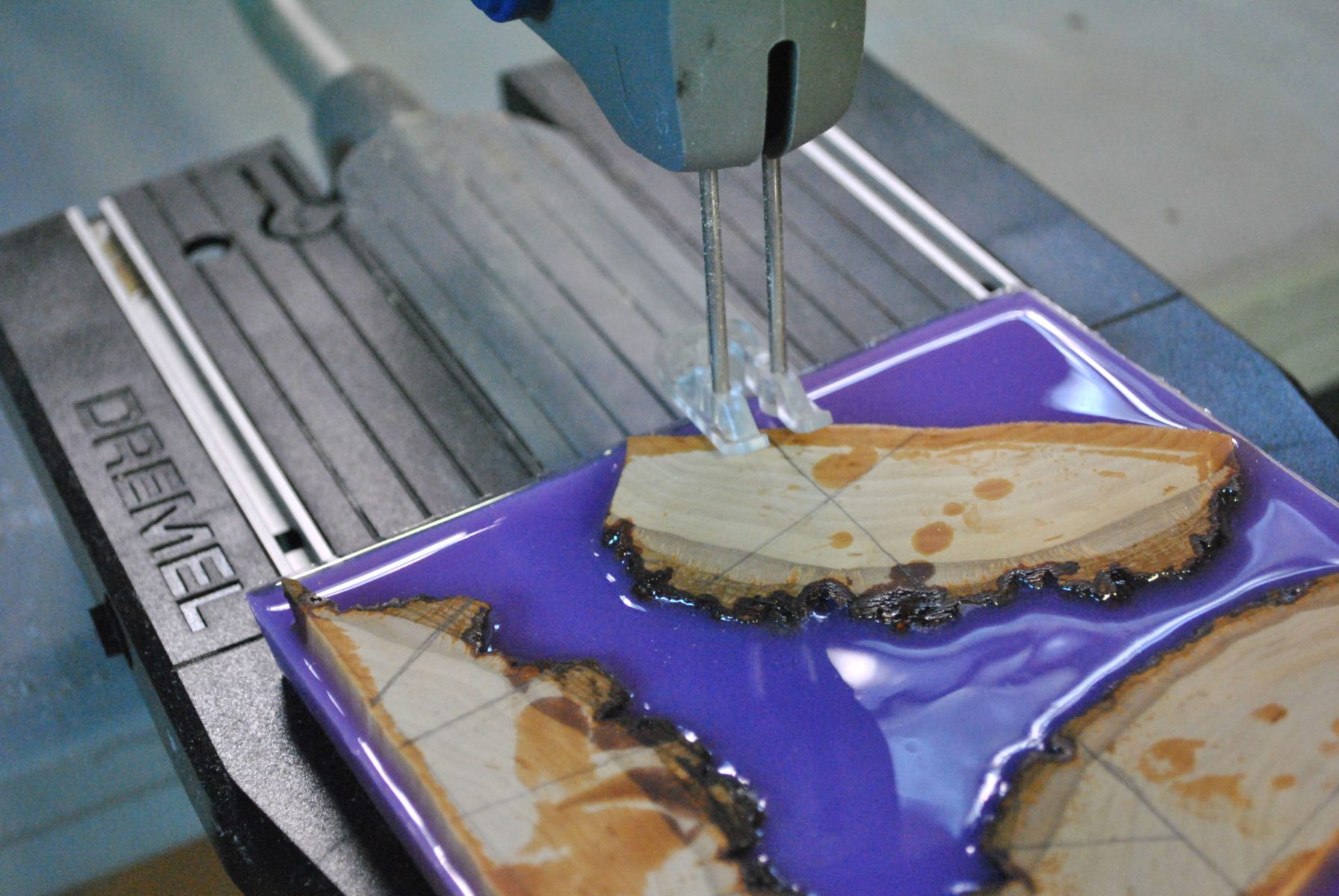 wood cuts in lavender resin being cut my dremel moto saw