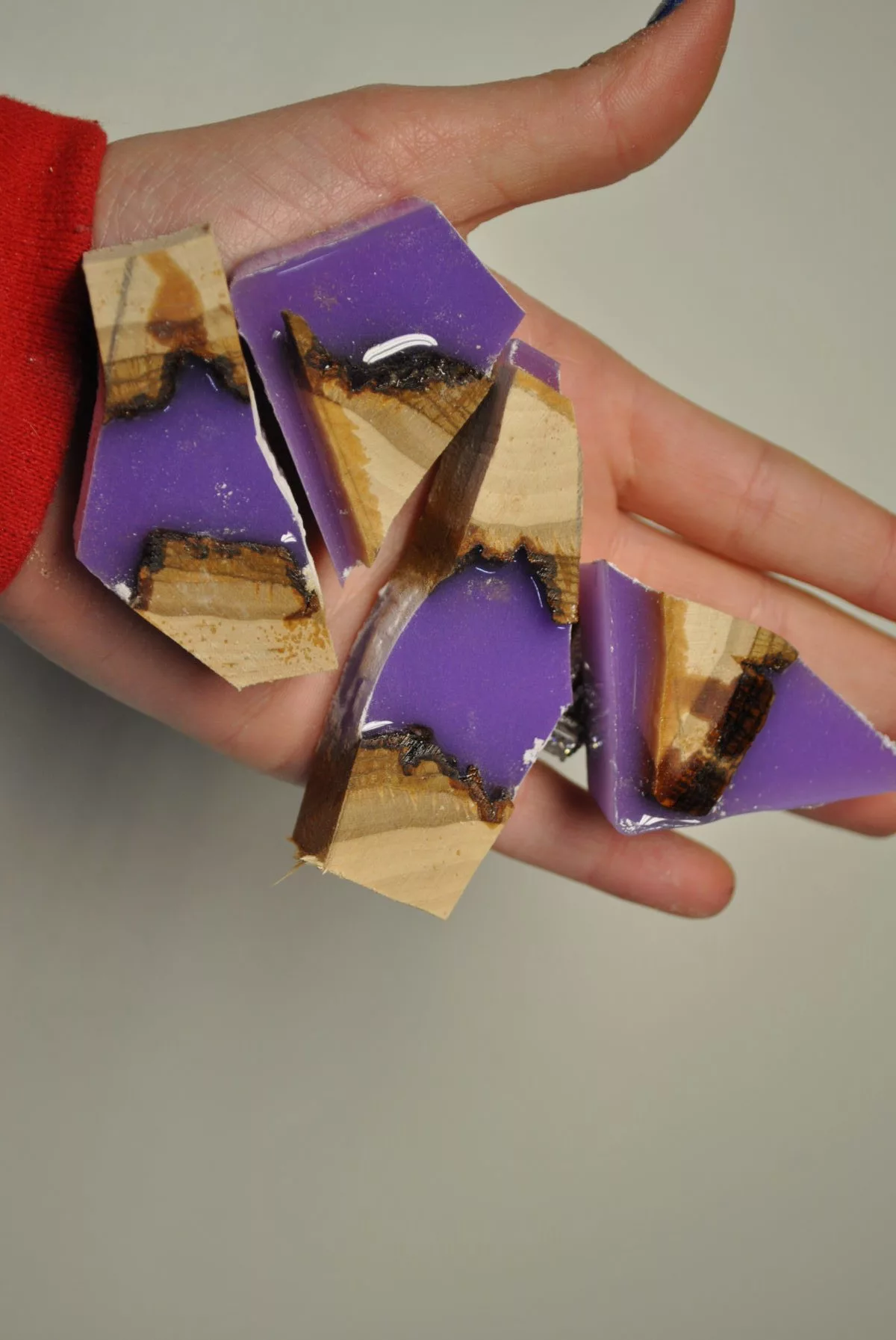 four pieces of cut wood and lavender resin