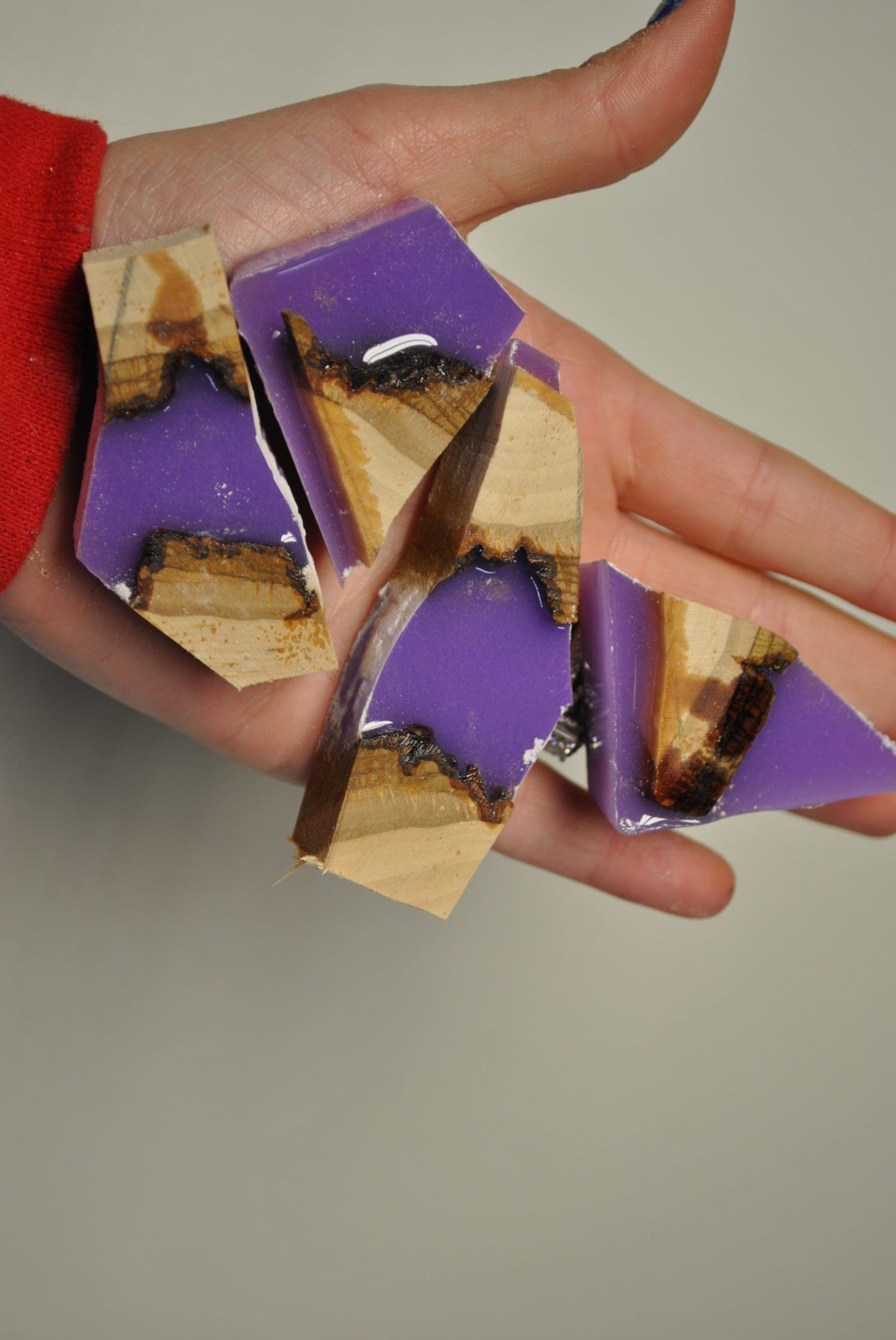 four pieces of cut wood and lavender resin