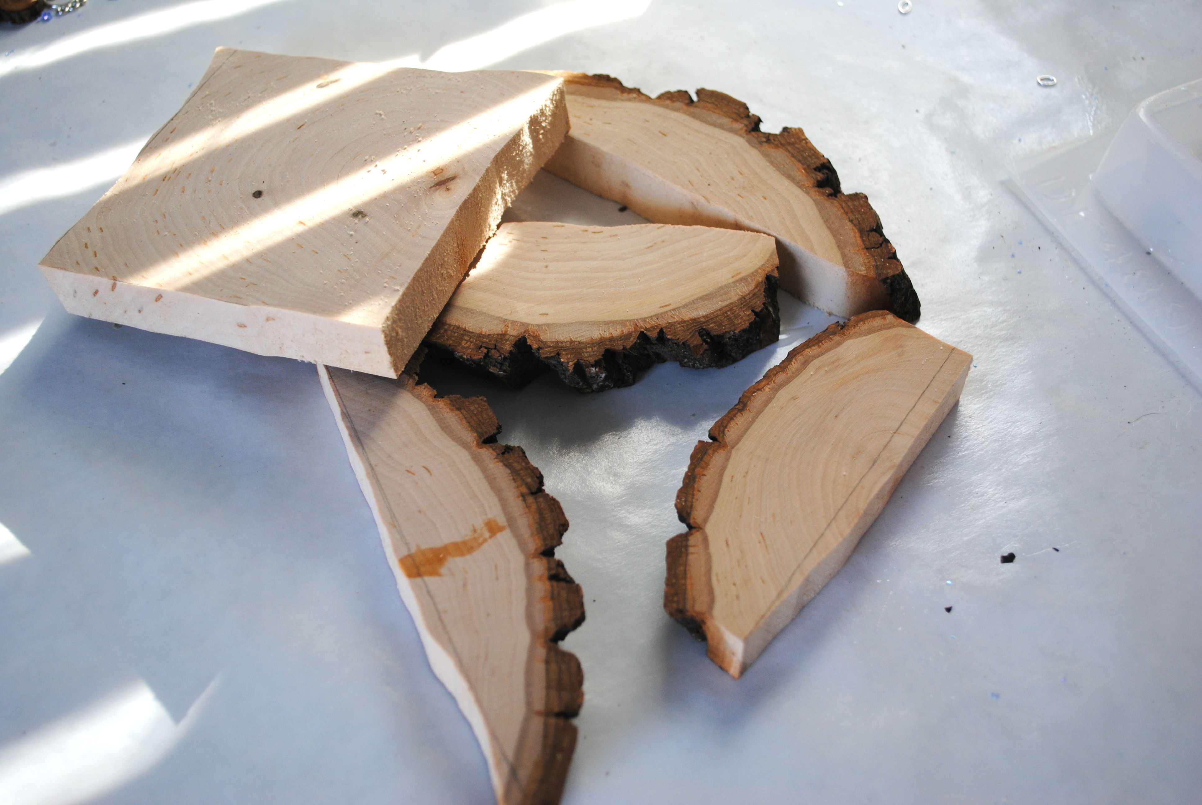 five cuts of wood on a table