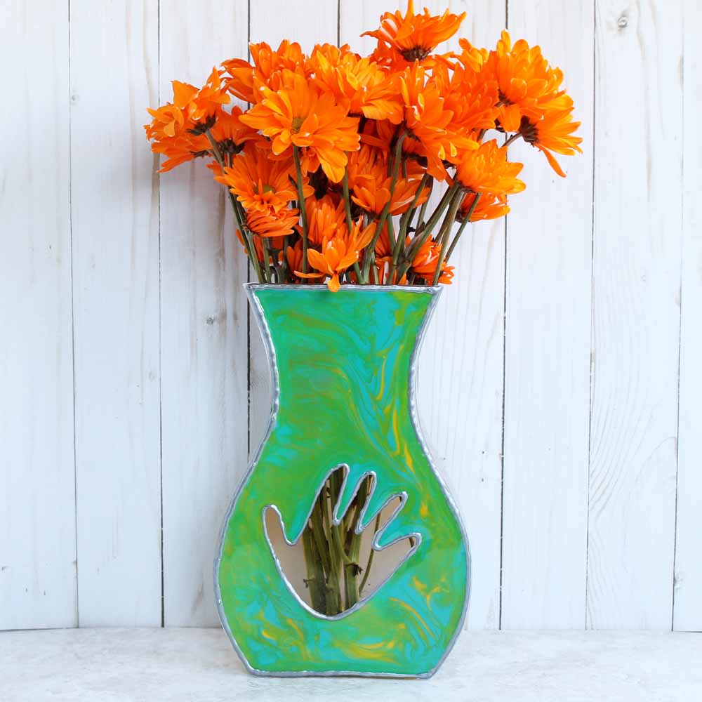 resin painted flat sided vase with child's handprint and flowers