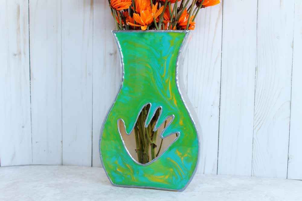 resin painted flat sided vase with child's handprint and flowers