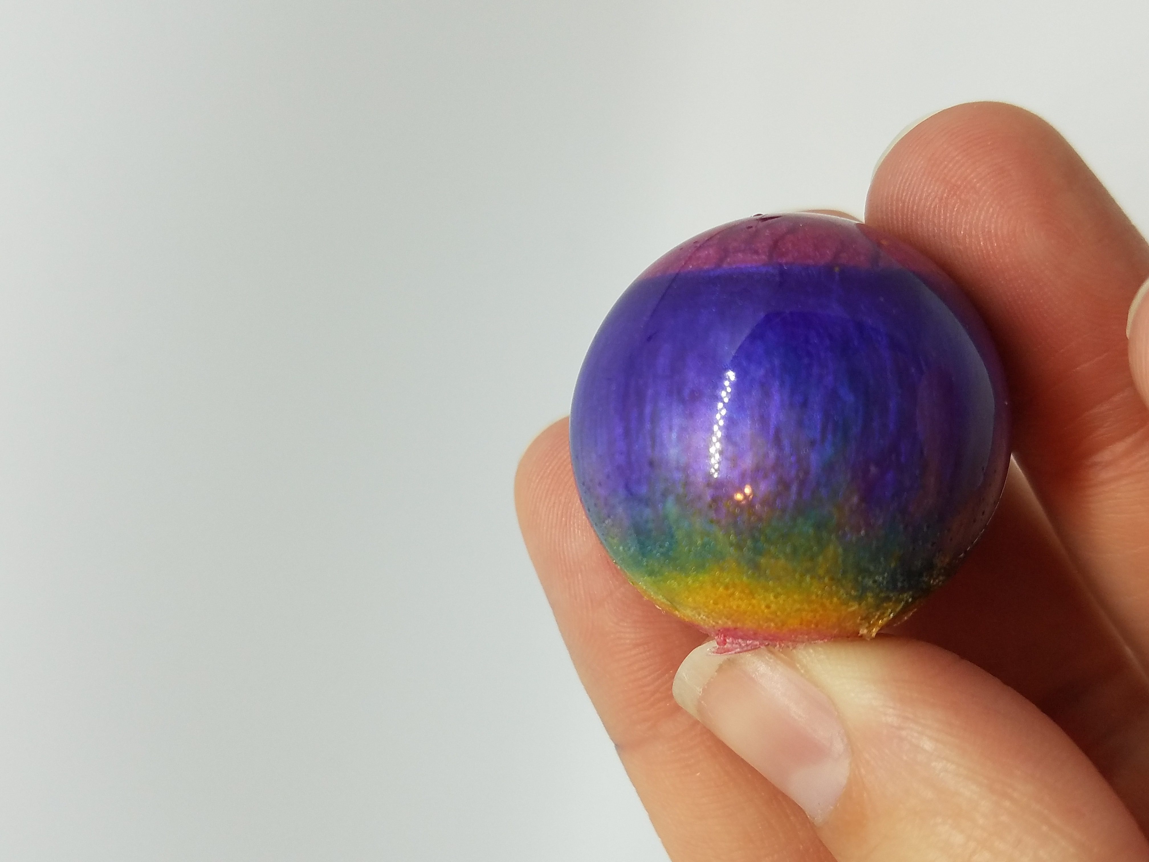 rainbow-colored epoxy orb