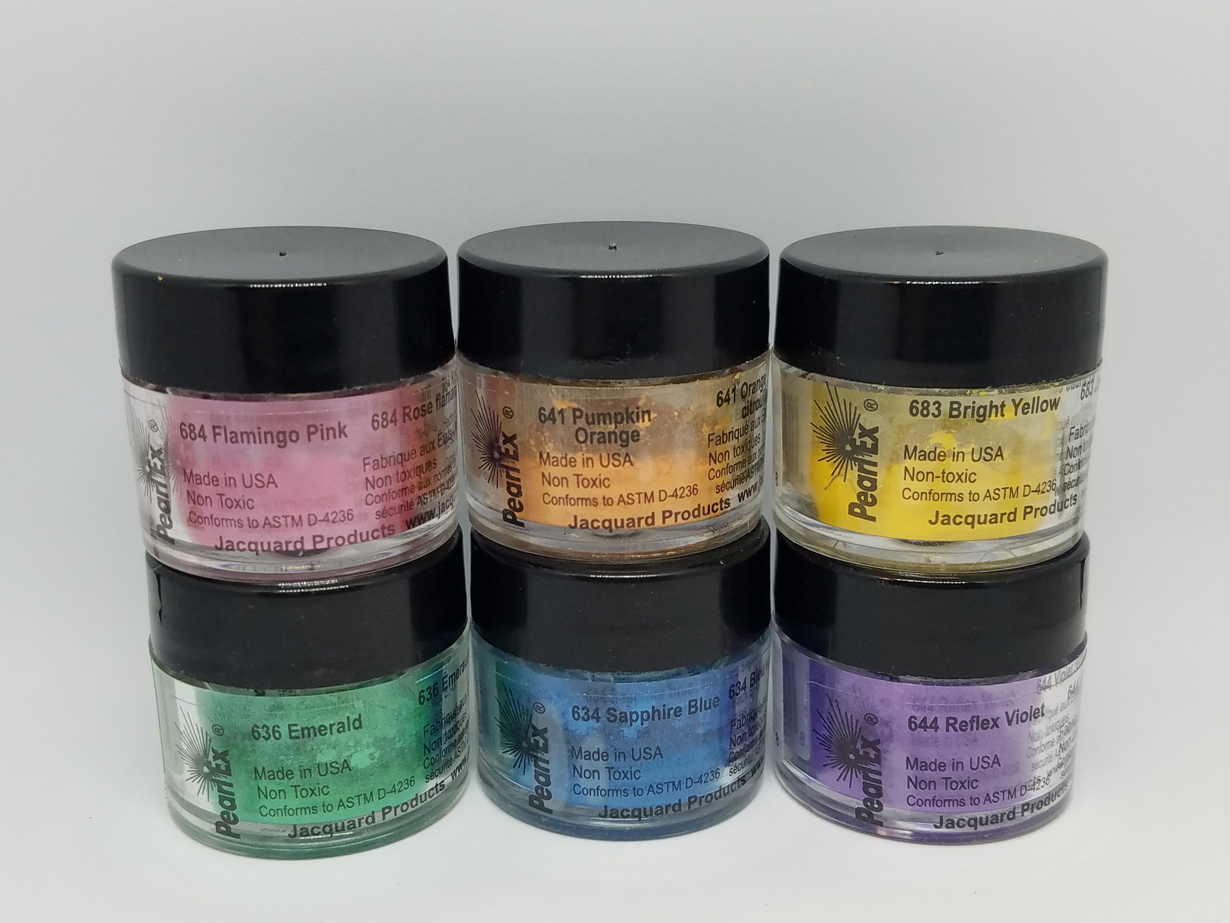 Jars of colorful resin pigment.