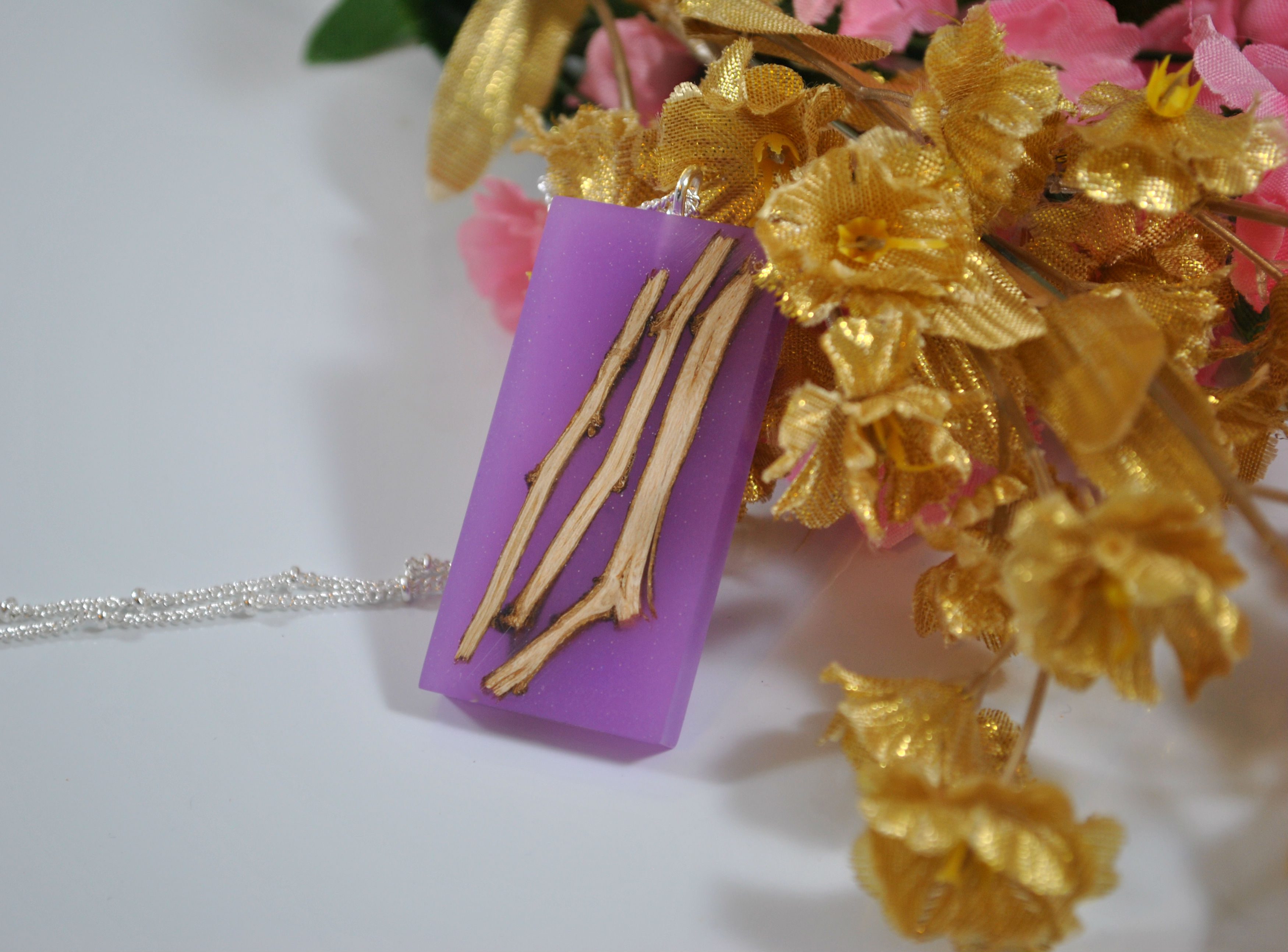 finished wood and resin pendant