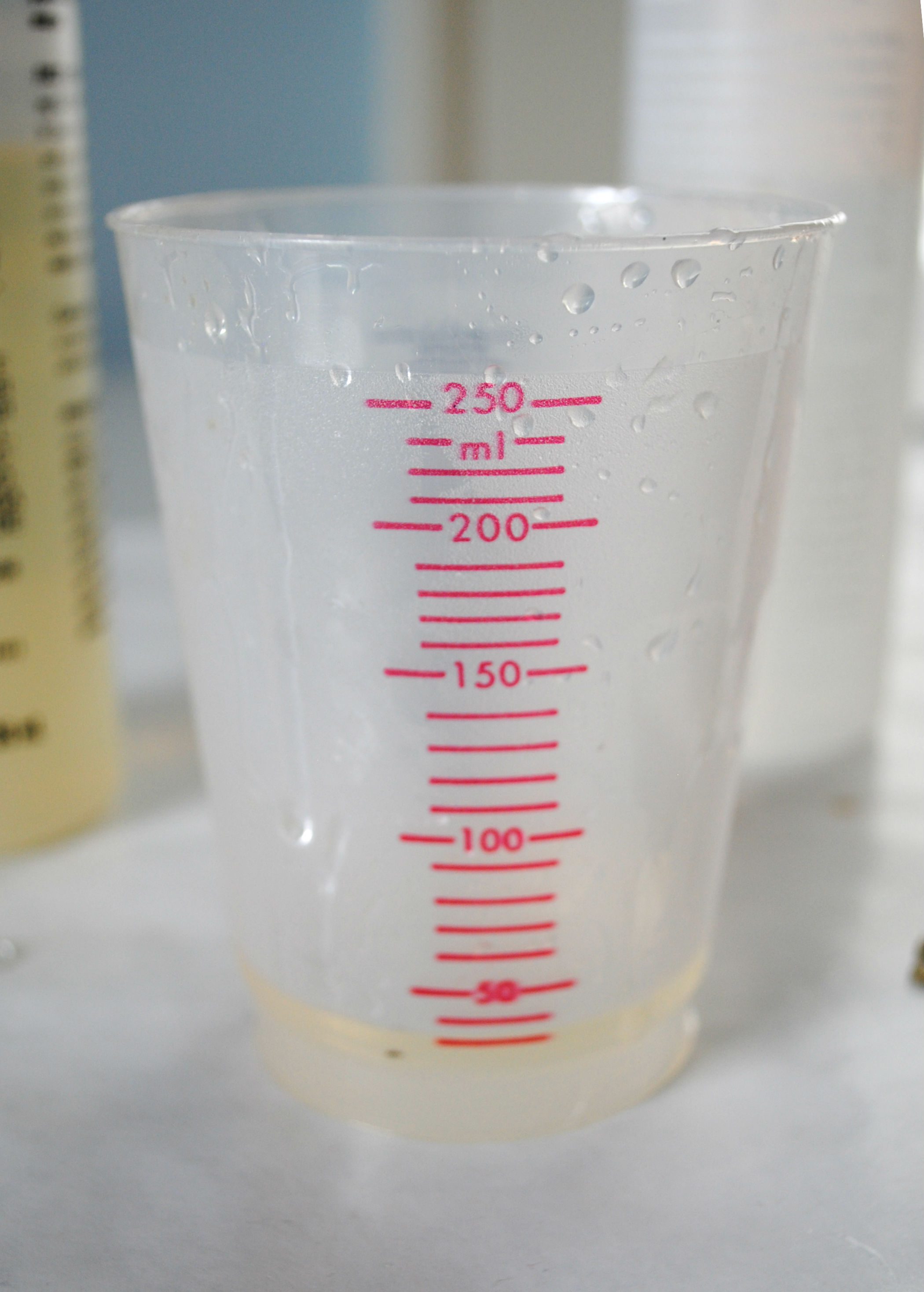resin mixed in plastic measuring cup