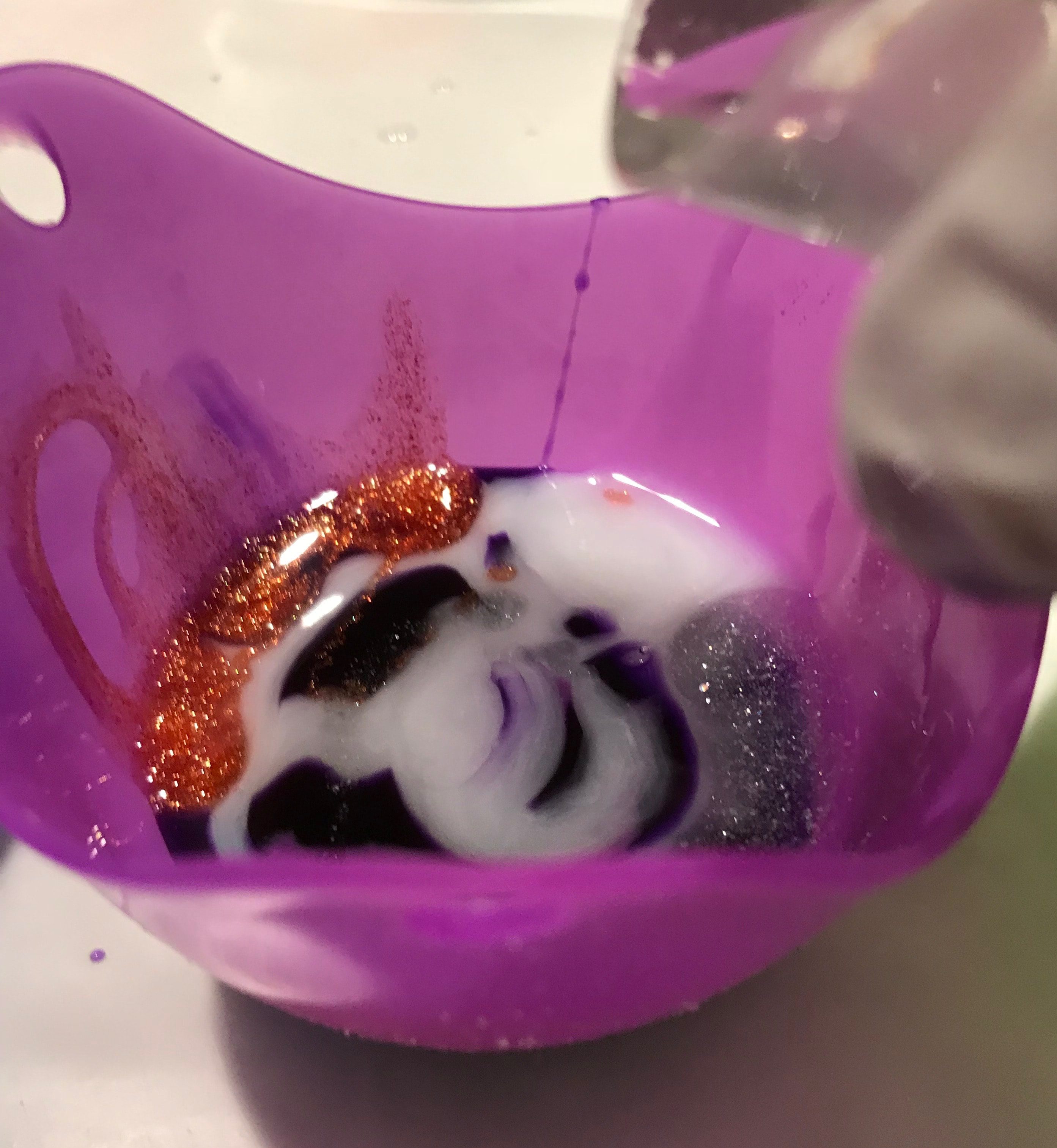 pouring resin into mold