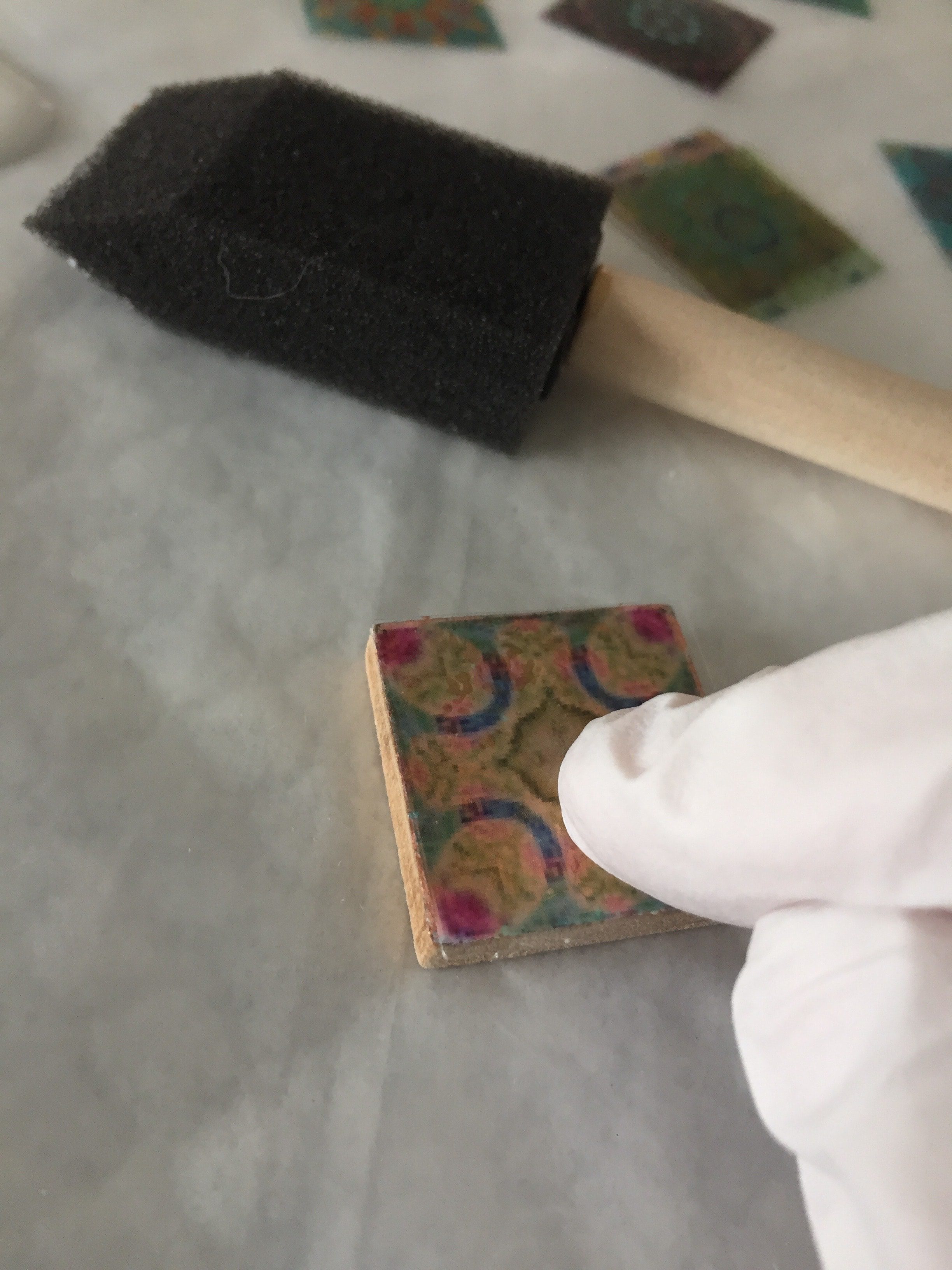 affixing mandala transparency to wooden tile