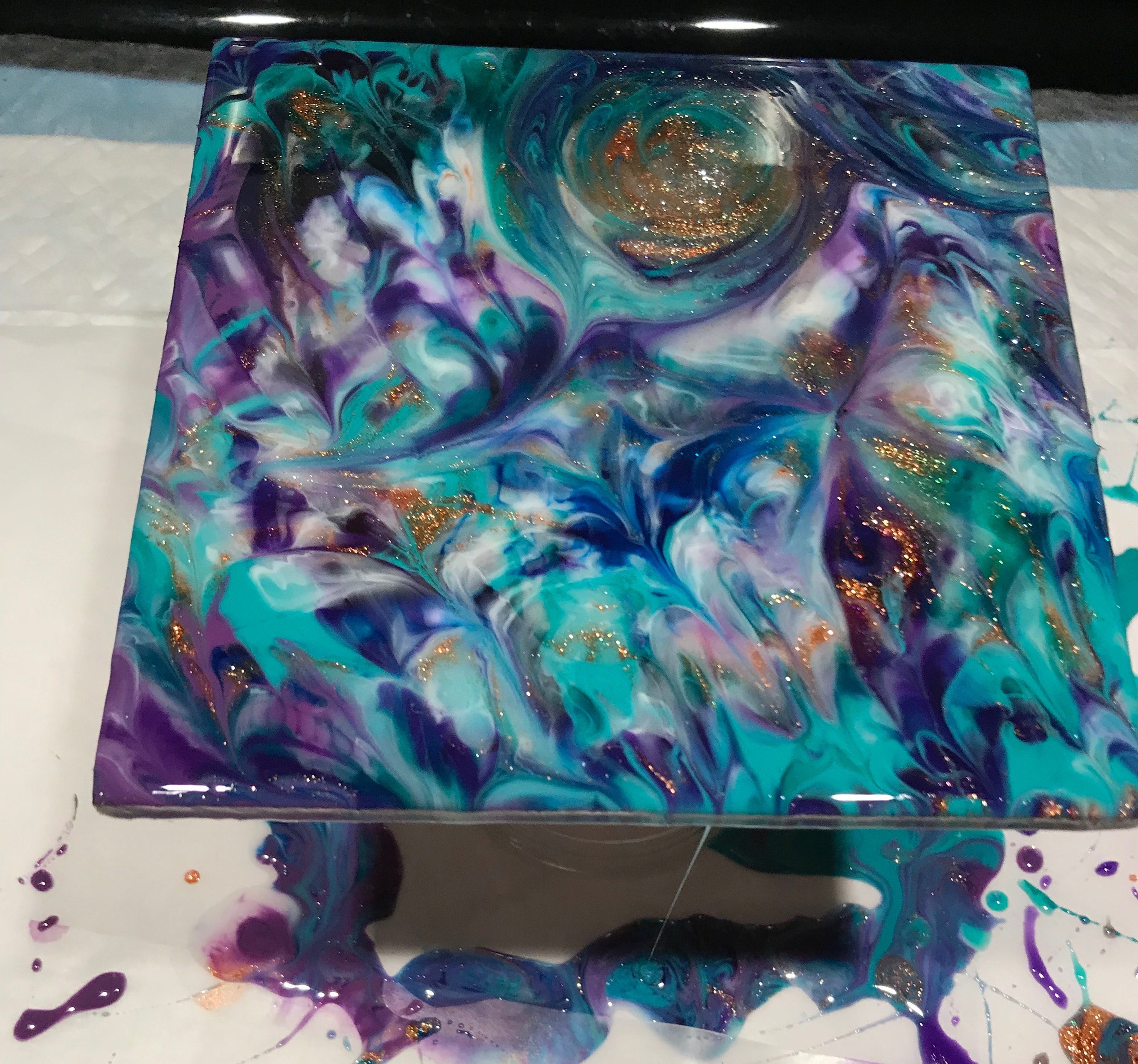 leftover resin poured on wodden canvas