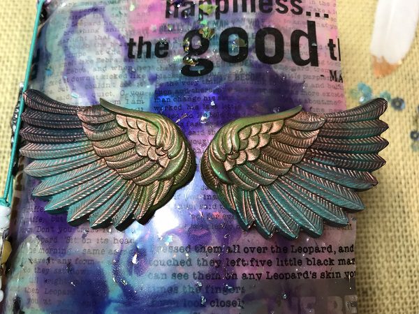 resin wings on journal cover