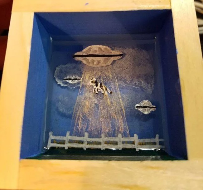 paint on resin cow and ufo