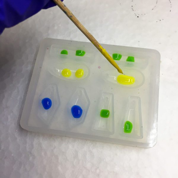 adding dots of color to a silicone mold
