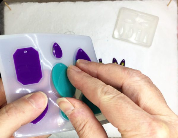 demolding resin charms from a silicone mold