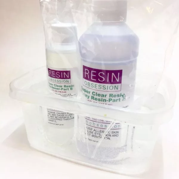 warming bottles of epoxy resin in a hot water bath