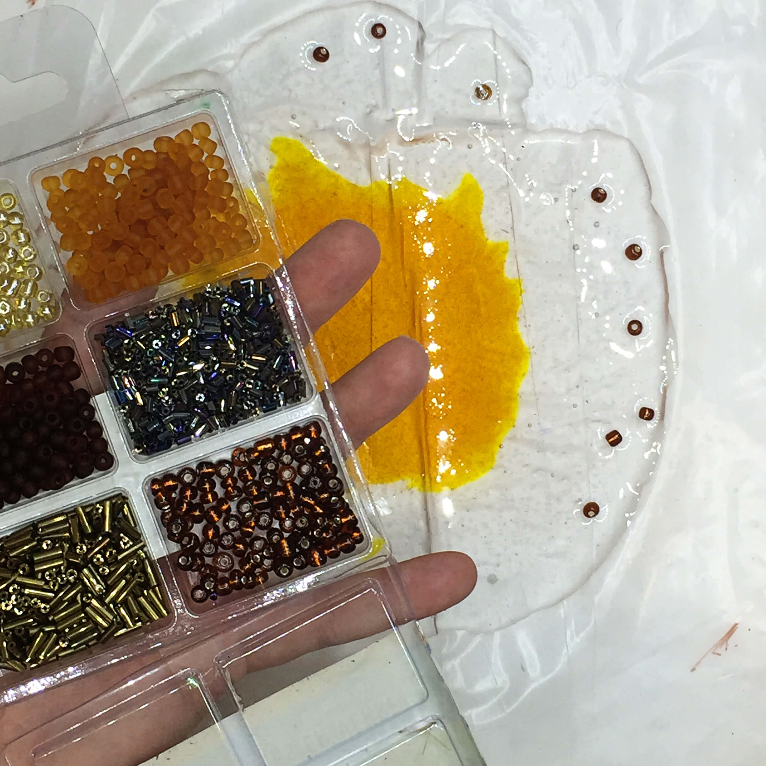adding complimentary colored beads to epoxy