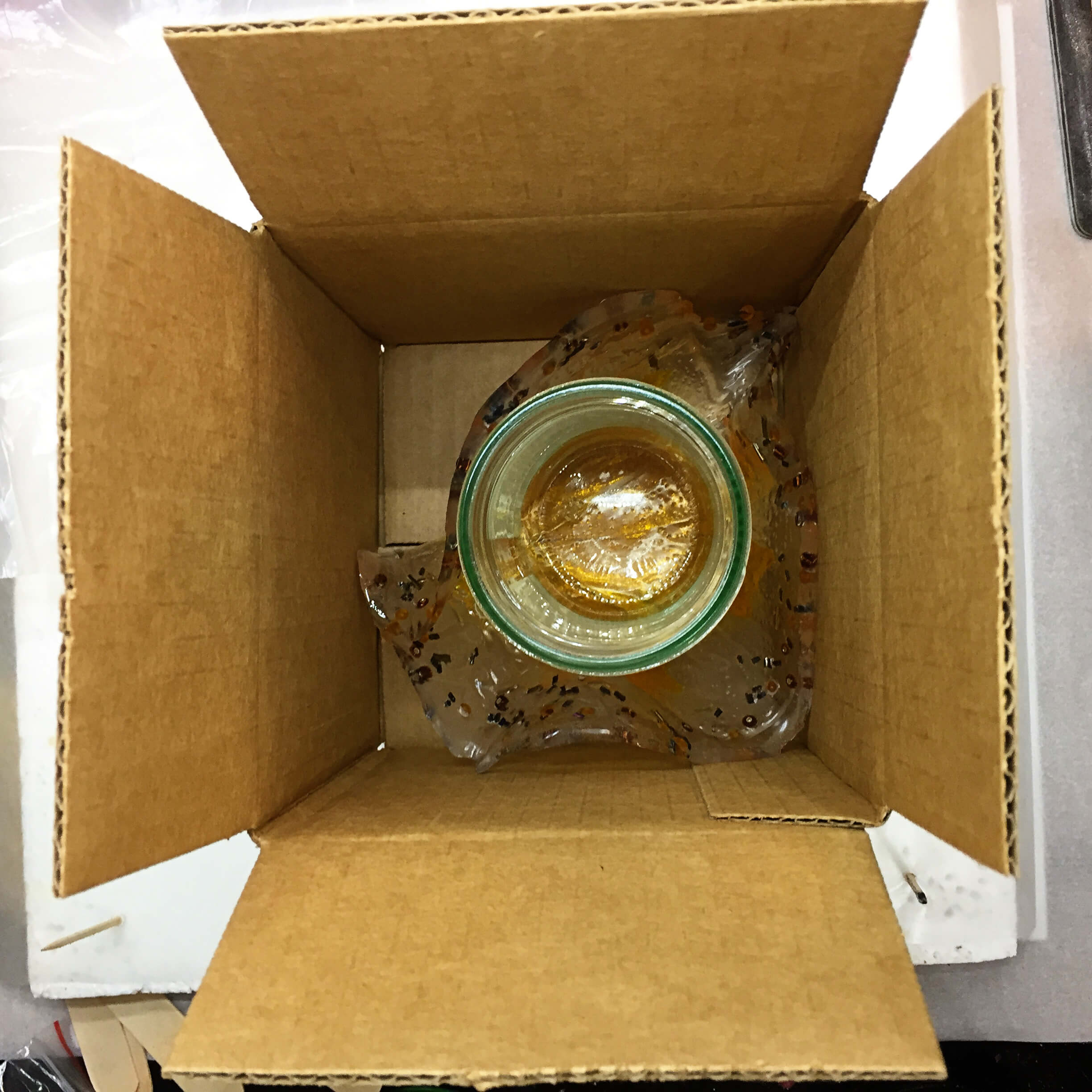 bending resin around jar in box