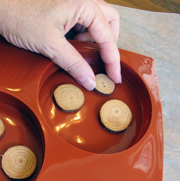 placing slices in coaster mold