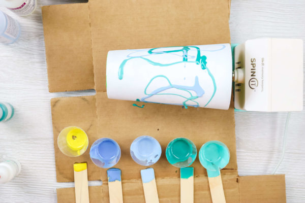 applying colored resin to a stainless steel tumbler