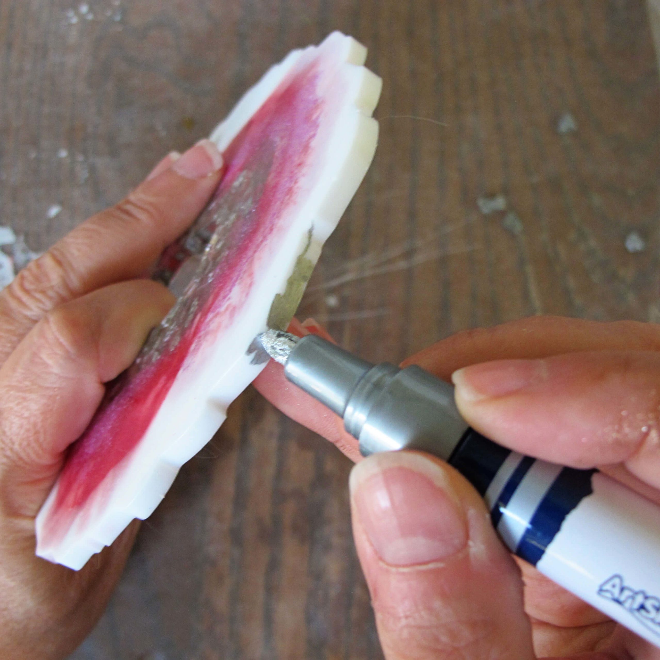 adding paint pen to a geode coaster edge