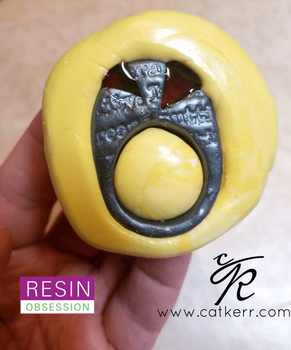 Polymer clay and resin ring in a mold