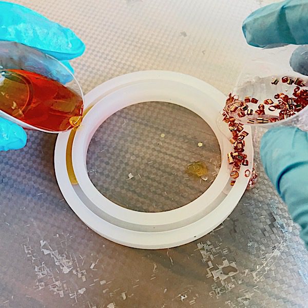 adding epoxy resin to a bracelet mold