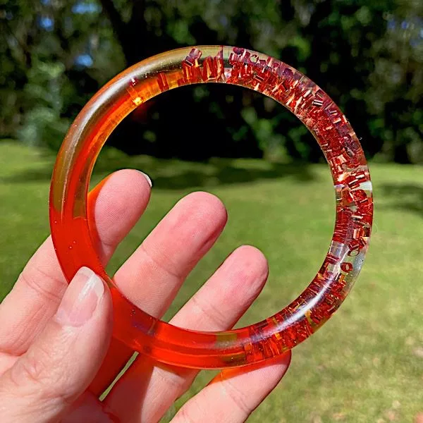 orange resin bracelet with glitter