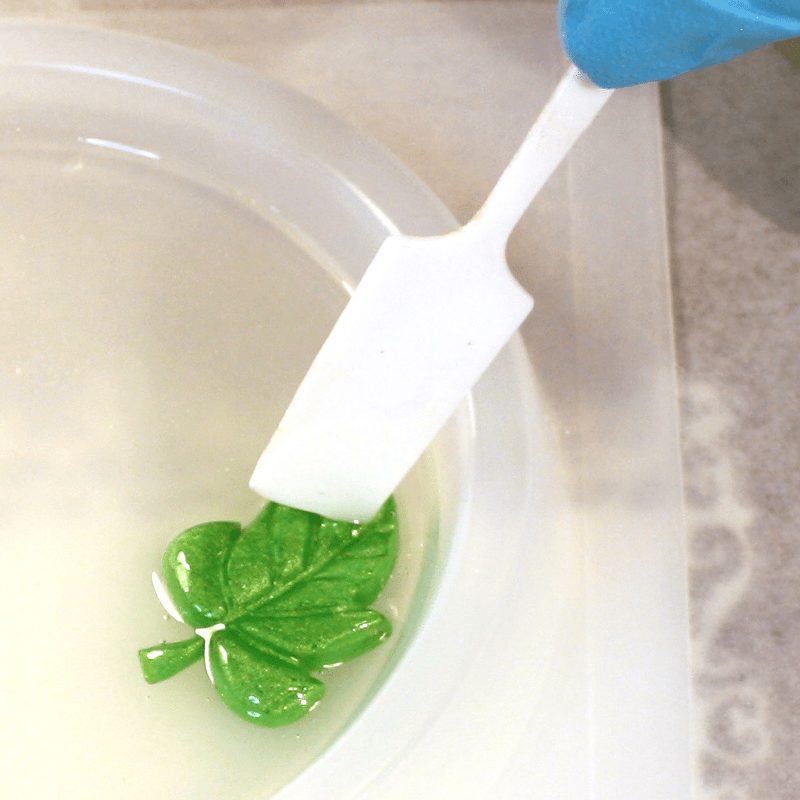 Positioning resin leaf into a mold