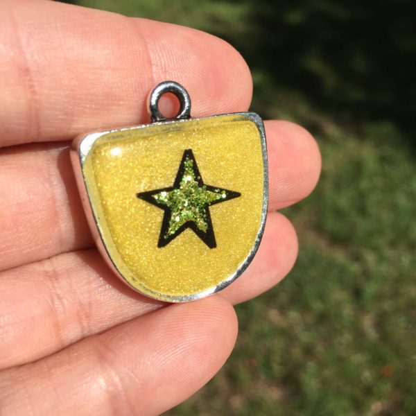 sticker in a resin pendant