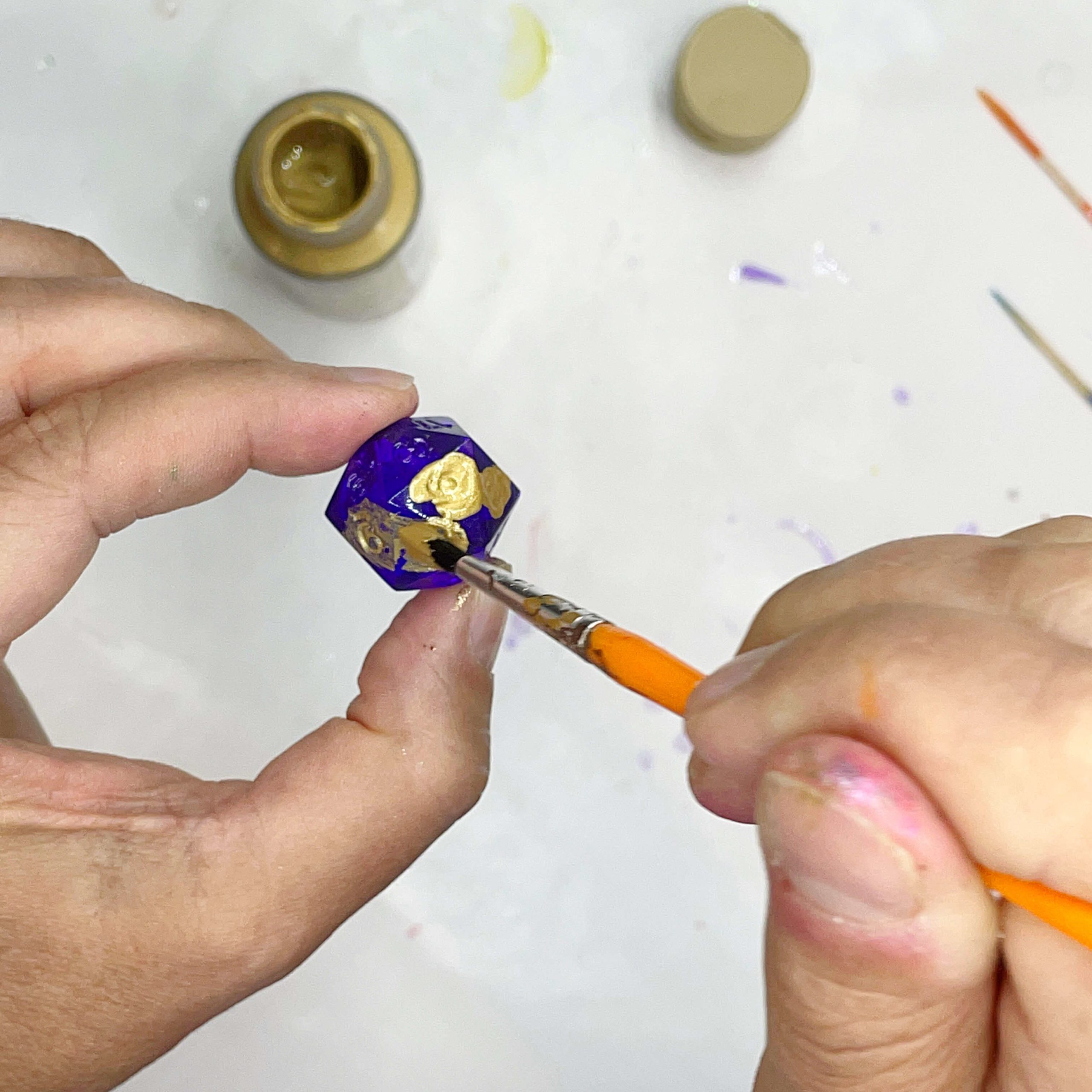 painting details on a resin die