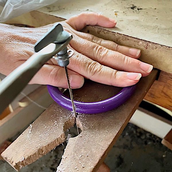 sawing a resin bracelet