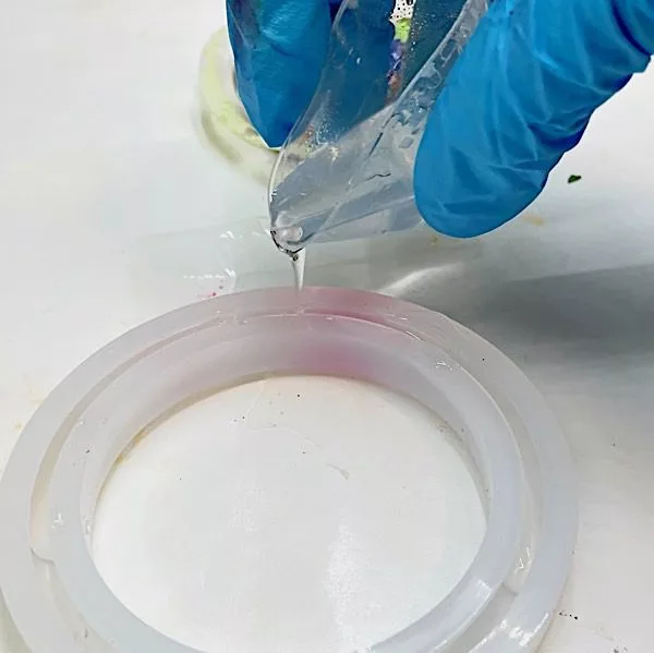 pouring resin into a mold